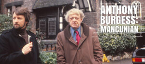 Anthony Burgess looking into the camera outside a house in Manchester